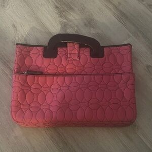 Elegant Pink Quilted Handbag with Black Accents